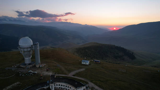istock Two large telescope domes at sunset. Drone view 1418201069