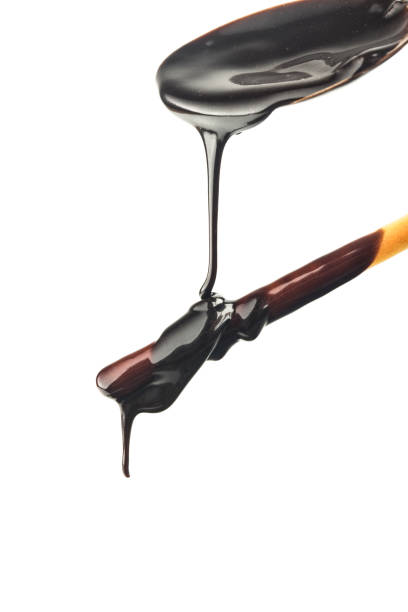 istock The chocolate sauce flows over the biscuit stick 1418202825