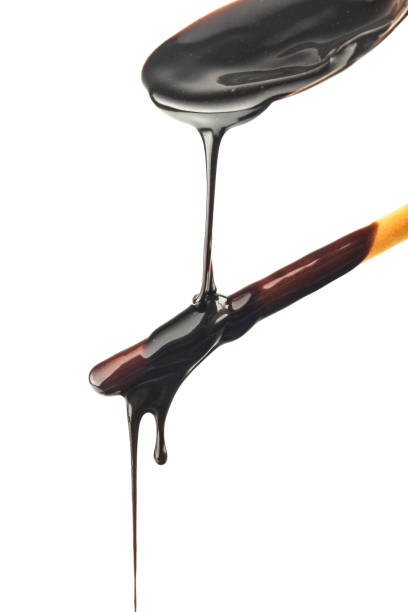 istock The chocolate sauce flows over the biscuit stick 1418202831
