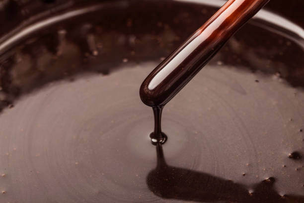 istock The chocolate sauce flows over the biscuit stick 1418202880
