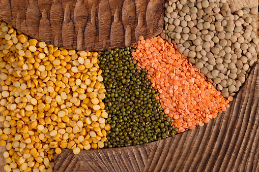 Green Yellow and Orange Lentils Pulses or Split Gram. High resolution image 45Mp taken with Canon EOS R5 and associate f2.8 macro lens