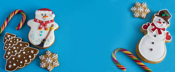 istock Christmas gingerbread on the blue background. Banner. Copy space. Top view. 1418206251