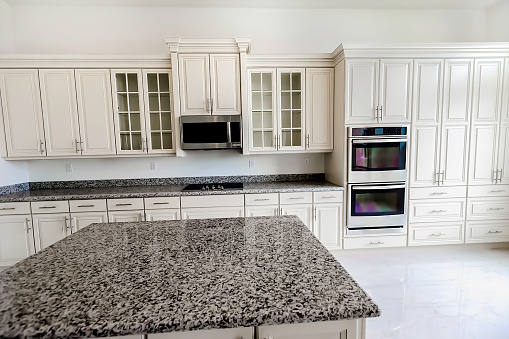 Double wall oven in a designer kitchen in a home that was just completed and waiting for owners to move in.