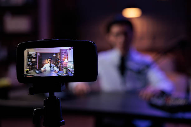 istock Asian vlogger filming video on camera 1418208791