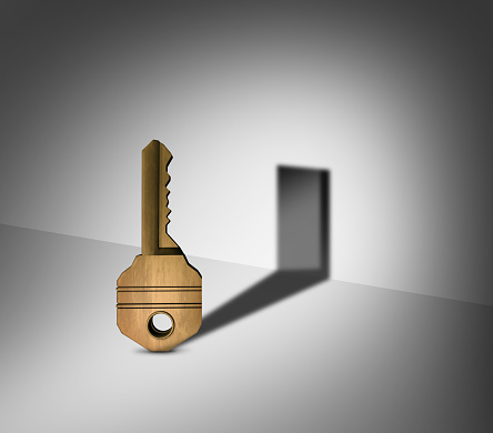 Cylinder key, used with scratches and decorative embossing, front view. A high resolution XXL image, isolated on white, clipping path.