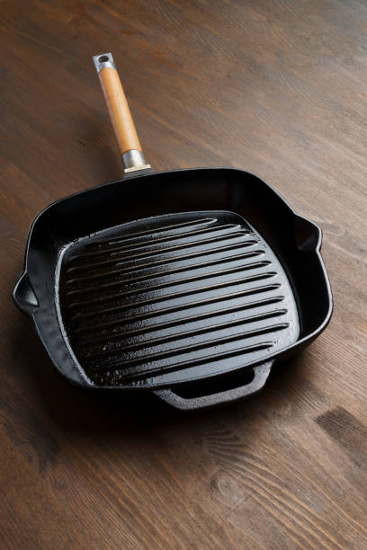istock Empty grill pan for frying bbq on wooden table 1418211550