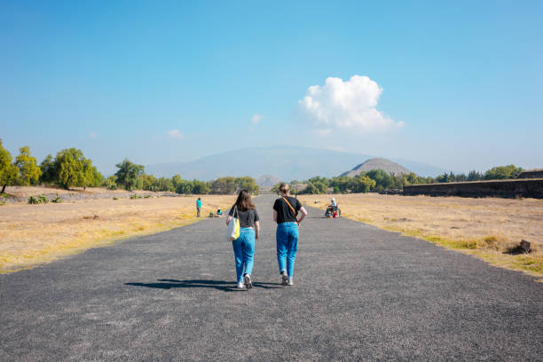 State of Mexico, Mexico; february 19 2022: tourists entering teotihucan, road of the dead and pyramids.