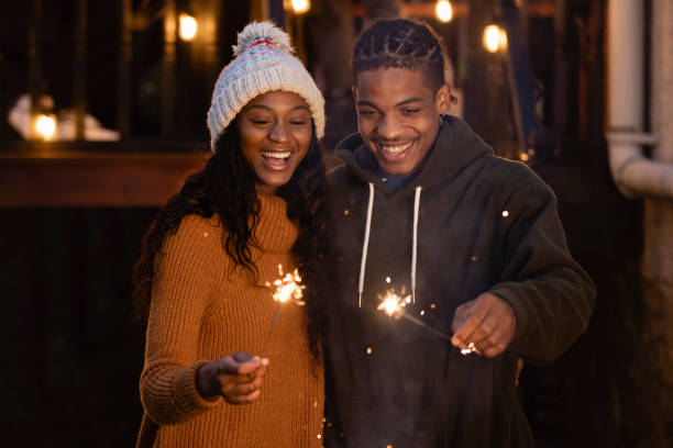 istock Two Adults Holding Sparklers Outside 1418215033
