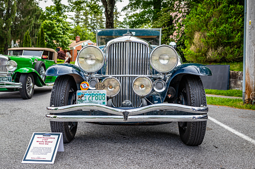 Highlands, NC - June 11, 2022: Low perspective front view of a 1933 Duesenberg J-427 Murphy Bodied Town Car at a local car show.