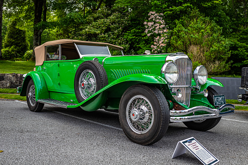 Highlands, NC - June 11, 2022: Low perspective front corner view of a 1929 Duesenberg  J-Murphy Convertible Berline at a local car show.