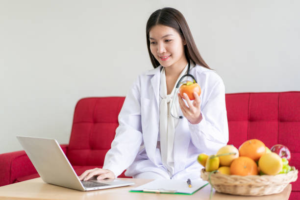 istock Nutritionist talking to patient on a video conference. 1418223216