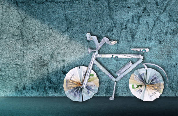 Electric bicycle made from banknotes for voucher stock photo