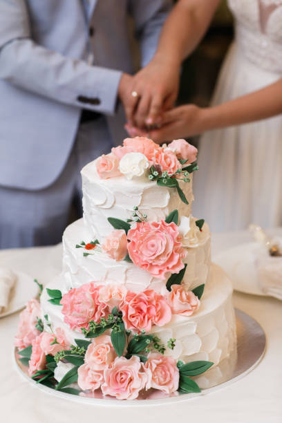 istock Multilevel wedding cake decorated with pink flowers 1418227163