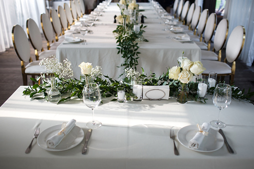 Decorated served table for wedding party or other event.