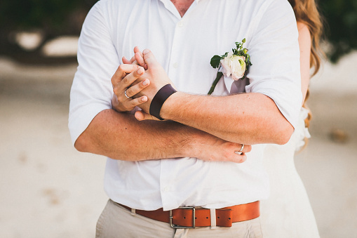 Elegant wedding boutonniere on the groom's suit