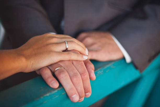 istock The bride and groom hold each other's hands 1418228312