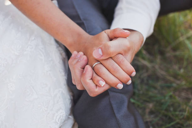 istock The bride and groom hold each other's hands 1418228314