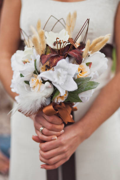 istock Bright wedding bouquet in hands of the bride 1418228325