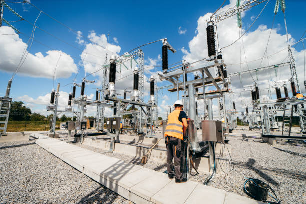 istock Adult electrical engineer mount the electrical systems at the equipment control cabinet. Installation of modern electrical station 1418233825