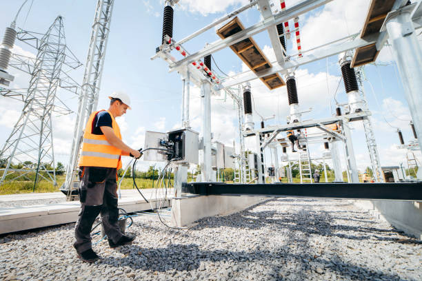 istock Adult electrical engineer mount the electrical systems at the equipment control cabinet. Installation of modern electrical station 1418233827