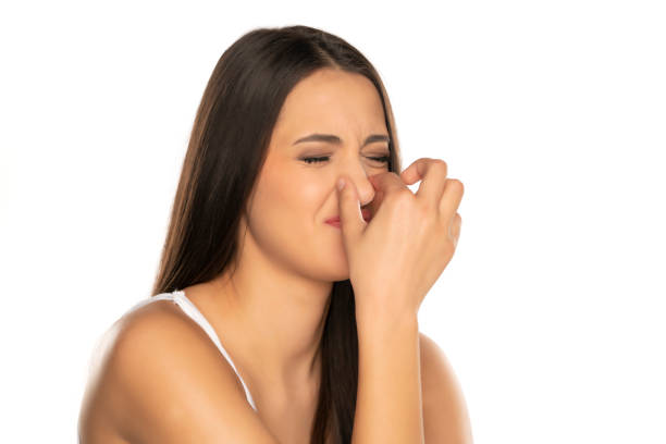 istock Young Woman Pinching Nose 1418234216