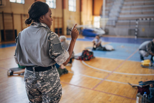istock Soldier counting civilians 1418238136