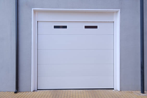 istock white garage door with two small windows on the upper part 1418240456