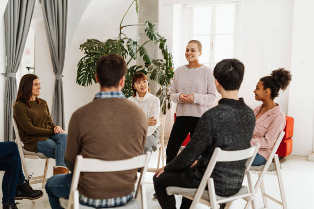 istock Woman talking about depression and anxiety in the group session 1418245344
