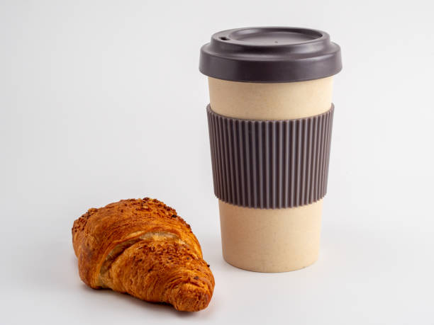 istock Croissant and a cup of coffee on a white background. 1418246931