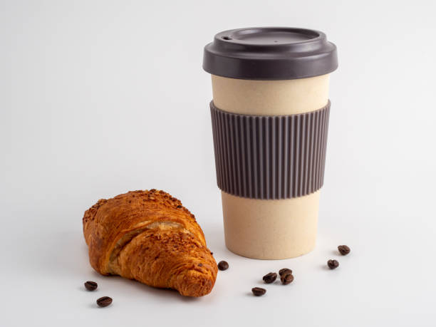 istock Croissant and a cup of coffee on a white background. 1418246946