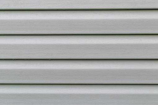 The surface of the pistachio plastic siding is a close-up as a background. Abstraction. Mock up