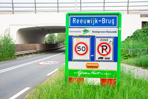 Reeuwijk-Brug, Netherlands - August 2022: Location sign of Reeuwijk-dorp, municipality of Bodegraven-Reeuwijk, province of Zuid-Holland.