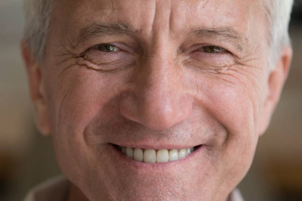 istock Optimistic healthy older man close up cropped face view 1418260585