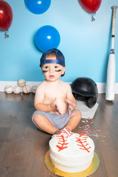 istock One Year Old With Birthday Cake Baseball Theme 1418262916