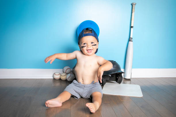 istock Dancing One Year Old Baby Boy With Baseball Birthday Theme 1418262951