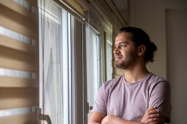 istock young and handsome architect with long hair in his office 1418262991