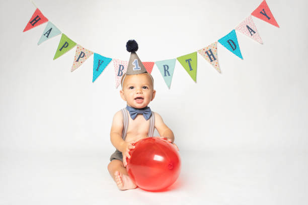 istock One Year old Baby Boy With Red Balloon 1418263997