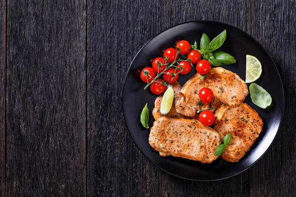 istock tomato basil pesto fried pork cutlets on plate 1418264369