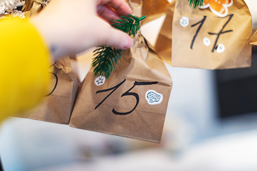 Advent calendar made from homemade craft paper bags with handwritten numbers