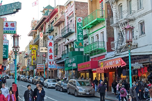 People moving through their day on Jackson street Chinatown San Francisco in November 2009. A vibrant cultural community exists in Chinatown with many shops and eating establishments.