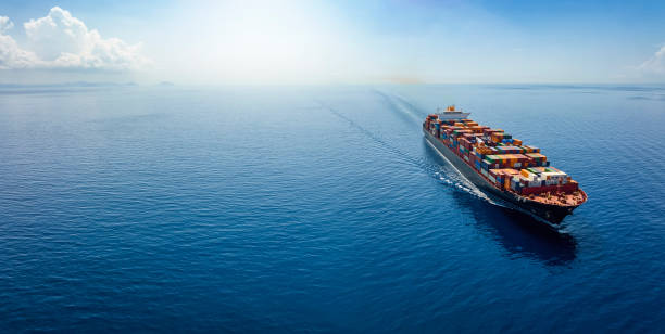 istock Aerial panorama of a cargo ship carrying container for import and export 1418267717