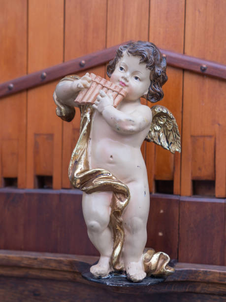 istock Angel putto with pan flute 1418276558