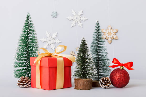 istock Christmas composition. craft Gift box, small tree, branches and craft DIY decorations on white background. New year concept. Christmas home decoration Flat lay, top view, copy space 1418278470