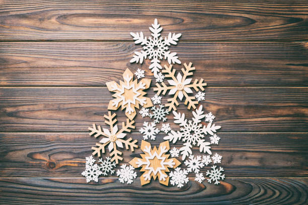 istock Christmas tree made from colored handmade ball decoration on colored background, view from above. New Year minimal concept with copy space 1418278761