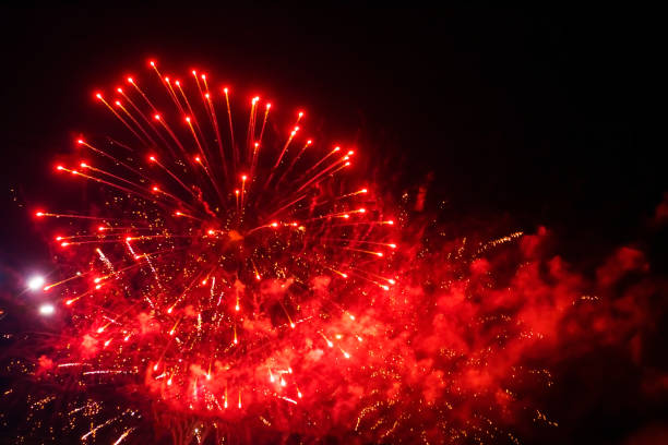 istock Bright, beautiful red fireworks in the night sky. 1418279946