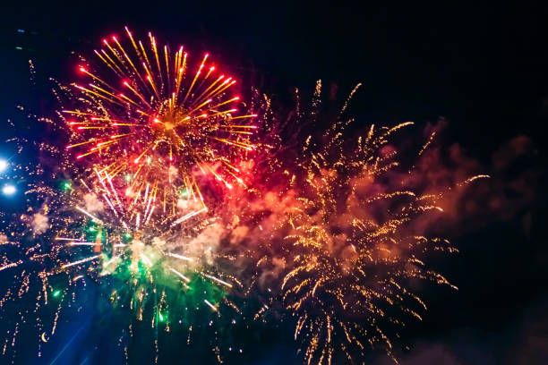 istock Beautiful multi-colored fireworks against the background of the night sky. 1418282974