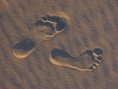 Foot prints in the setting sun of White Sands, New Mexico