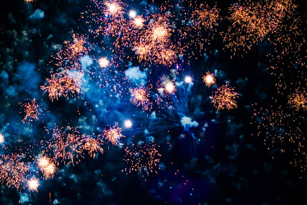 Bright, beautiful blue fireworks in the night sky. High quality photo
