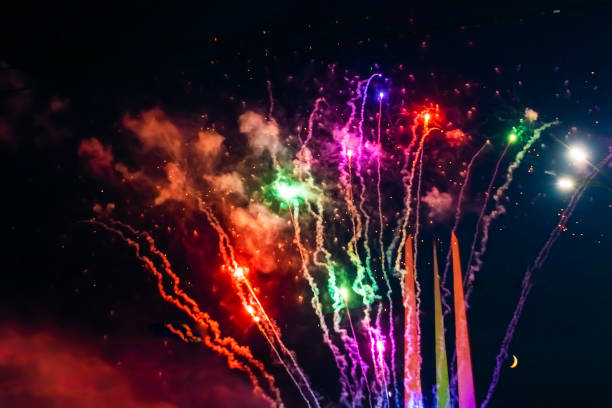 Beautiful multi-colored fireworks against the background of the night sky. stock photo