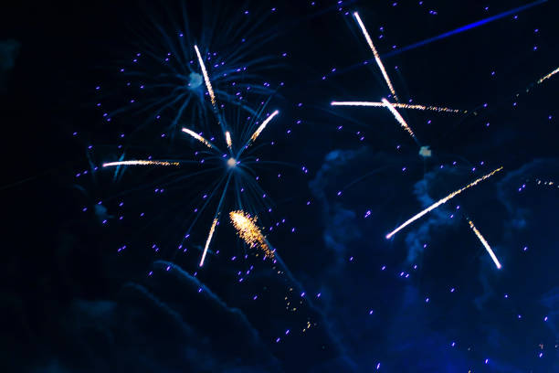 Bright, beautiful blue fireworks in the night sky. High quality photo